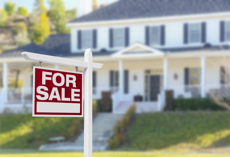 For Sale sign in front of a two-story home listed for sale in the Dallas–Fort Worth area
